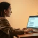 Person using ChatGPT on a laptop in a home office, representing AI safety features