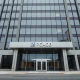 Exterior of the PCAOB headquarters building in Washington, D.C., under overcast sky.