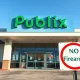 Exterior of a Publix grocery store in Florida with a no firearms sign visible on the entrance door.