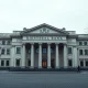 Riksbank building in Stockholm on a cloudy autumn day, representing Swedish monetary policy.