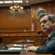 Sam Altman testifying in a California courtroom during the Elon Musk lawsuit against OpenAI.