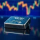 Silver bar on reflective surface with market charts in background