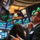 Traders on NYSE floor as S&P 500 and Nasdaq 100 reach record highs
