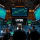 NYSE trading floor with green screens showing record highs for S&P 500 and Nasdaq 100