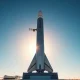 SpaceX Starship rocket on launch pad at sunrise, symbolizing the company's ambitious IPO and space goals.