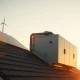 Futuristic residential solar microgrid installation at sunset, representing DePIN technology.