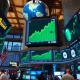Stock exchange floor with green screens showing record highs amid tech earnings and falling oil prices