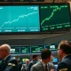 NYSE trading floor with green displays showing S&P 500 and Nasdaq 100 at record highs