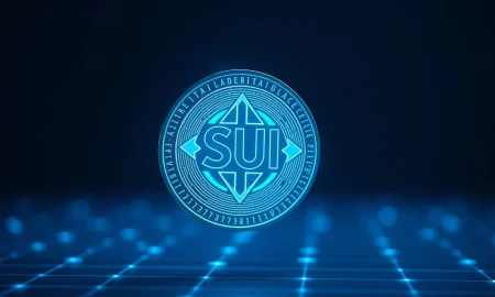 Digital SUI token coin glowing on a dark futuristic background representing blockchain technology.