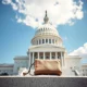 United States Capitol building on a clear day, with a small savings book in the foreground symbolizing retirement security.
