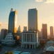 Bangkok financial district skyline at sunset, representing Thailand's economic policy and fiscal stability.