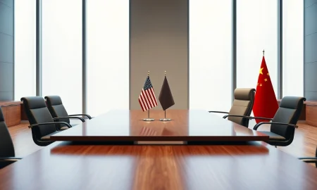 Empty diplomatic meeting room with US and Chinese flags ahead of Trump-Xi summit