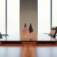 Empty diplomatic meeting room with US and Chinese flags ahead of Trump-Xi summit