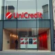 Exterior of a UniCredit bank branch in a European city, representing the bank's corporate presence and ongoing restructuring.