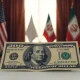 US dollar banknote in foreground with blurred US and Iranian flags in background during peace talks