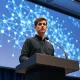 Vitalik Buterin speaking at a tech conference about AI and smart contract security