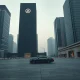 Empty financial district in a Gulf city at dusk with darkened skyscrapers and no pedestrians