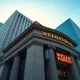Wells Fargo bank building exterior on a clear morning, representing institutional investment in Ethereum ETFs.