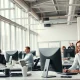 Professionals in a modern open office whispering into computers and wearing headphones