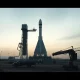 SpaceX Starbase launch site with Starship rocket on pad and construction equipment in foreground