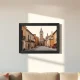 Aura Ink e-ink photo frame mounted on a wall displaying a travel photo