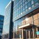 Modern commercial office building in a US city, representing a real estate acquisition target.