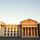 Four central bank headquarters: Federal Reserve, Bank of Japan, Bank of England, and Reserve Bank of Australia
