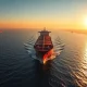 Oil tanker in the Strait of Hormuz at sunset
