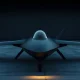 Sleek black drone prototype on a tarmac at dusk in a defense tech hangar