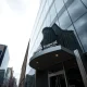 Exterior of the Financial Conduct Authority building in London on a cloudy day.