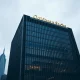 Exterior of the Goldman Sachs headquarters building in New York City at dusk.