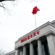 Exterior of the People's Bank of China headquarters in Beijing on a cloudy day.