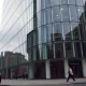 Exterior of Rathbones office building in London's financial district on a cloudy day
