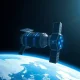 Satellite-like orbital data center module in space with Earth in background