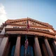 New York Stock Exchange building facade on Wall Street during golden hour, representing steady US Treasury yields and bond market conditions.