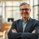 Toni Schneider, new permanent CEO of Bluesky, in a professional headshot in a modern office.