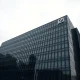 Deutsche Bank headquarters in Frankfurt on a cloudy day, reflecting stock decline news