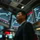 Bank of Japan official monitoring USD/JPY exchange rate screens on a Tokyo trading floor