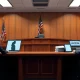 Courtroom scene with legal teams representing Midjourney and Hollywood studios in an AI copyright lawsuit