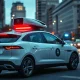 Waymo robotaxi in San Francisco street with emergency lights reflecting at dusk