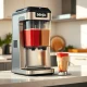 Ninja Slushi Twist frozen drink machine on a kitchen counter with two filled vessels