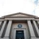 Exterior of the SEC headquarters building in Washington, D.C. on a sunny day.