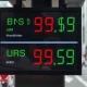 Currency exchange board in Bangkok showing Thai baht and US dollar rates