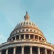 US Capitol building in Washington DC on a clear winter day, representing US economic policy and the Federal Reserve.