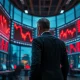 Trader observing declining charts on monitors in a modern office, representing the 67% July loss of Aschenbrenner's AI hedge fund.