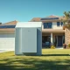 Home battery unit mounted on a suburban house wall in Austin, Texas