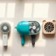 Four handheld mini fans from Dyson, Shark, JISULIFE and MACMORE lined up for comparison