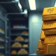 Stack of gold bars in a secure bank vault representing central bank gold reserves.