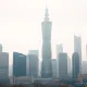 Beijing central business district skyline on a hazy day, reflecting economic slowdown after China's PMI fell below 50.