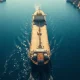 Aerial view of an oil tanker navigating the Strait of Hormuz amid geopolitical tensions.
